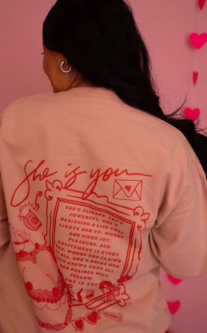 ‘She is you’ crewneck